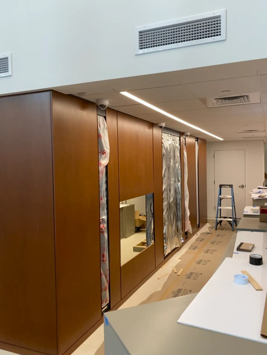 Wood millwork panels installed along a branch wall during construction
